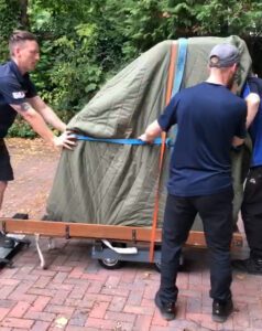 Moving a Grand Piano out of a House in Liverpool - Liverpool Storage Company